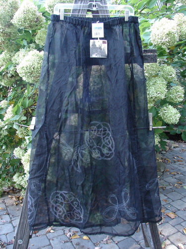 2000 NWT Silk Organza Skirt: A black skirt with a white design on it, featuring a lined flare, elastic waistline, and vertical exterior panels.