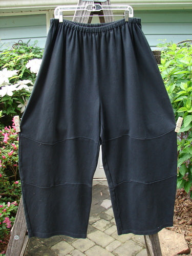 Vintage Barclay Interlock Moor's Pant in Black, Size 2. Full elastic waistband, unique pegged lower shape, mid-leg bell, and three sectional panels. Perfect condition, dense cotton fabric. Waist 32-42, Hips 64, Inseam 25, Length 42.