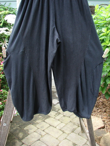 Alt text: Barclay Hemp Cotton Thermal Accent Circle Pant Unpainted Black Size 2 displayed on a wooden rack.