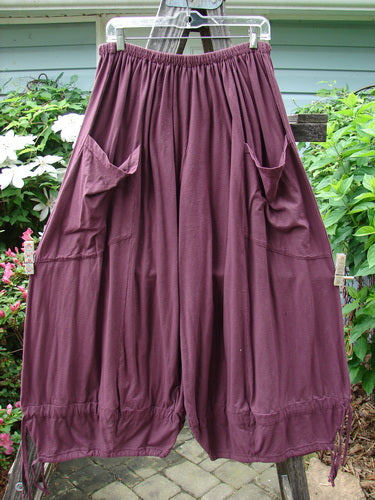 Barclay Tie Bottom Square Pant Unpainted Maroon Size 2 hanging on a clothesline, showcasing oversized exterior upper pockets and a full elastic waistline.