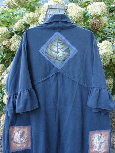 A blue Barclay PMU Patched Twill Decora Brushed Flutter Coat with a Falling Leaf design on it.
