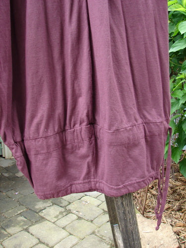 Barclay Tie Bottom Square Pant Unpainted Maroon Size 2 displayed on a pole, showcasing its full elastic waistline and oversized exterior upper pockets.