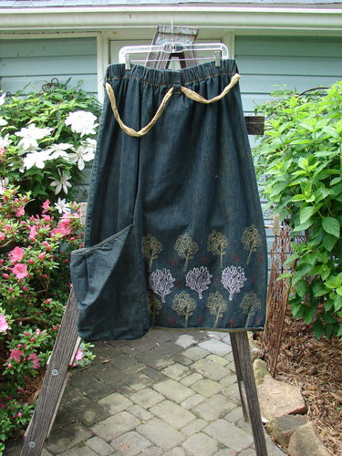 Barclay Heavy Weight Denim Belted Pocket Skirt Tree Blue Indigo Size 2, featuring a thick elastic waistline, oversized front pocket, and sectional vertical panels, displayed on a clothes rack.