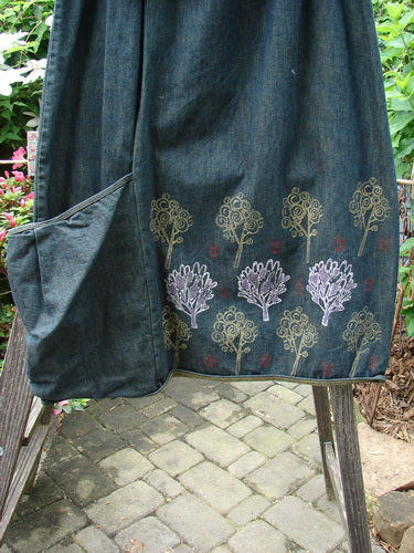 Barclay Heavy Weight Denim Belted Pocket Skirt Tree Blue Indigo Size 2, showcasing a forest-themed design with a full elastic waistline, belt loops, and an oversized front wrap pocket.