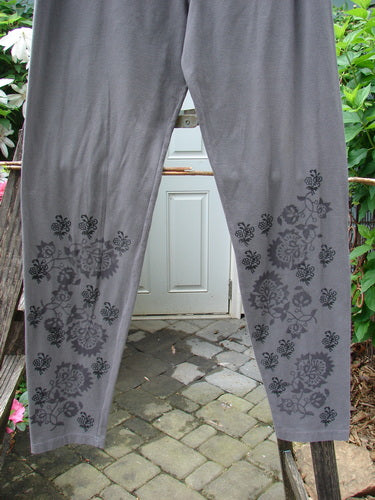 Barclay Cotton Lycra Legging Botanicals Grey Plum Size 2, featuring a relaxed fit with floral designs, showcased on a mannequin.