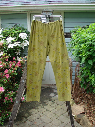 A pair of Barclay NWT Cotton Lycra Legging Leaf Flower Peapod Size 2, featuring a relaxed leg design with a continuous leaf and flower pattern, displayed on a rack.