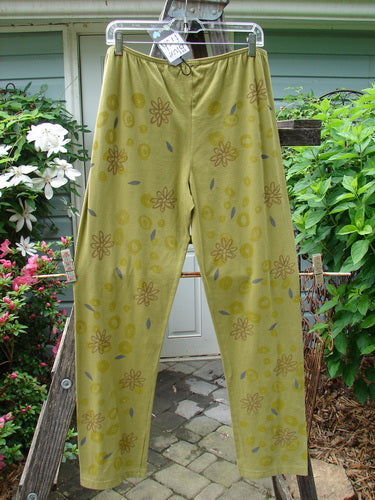Pair of Barclay NWT Cotton Lycra Legging Leaf Flower Peapod Size 2 hanging on a clothesline, showcasing relaxed fit and floral pattern.