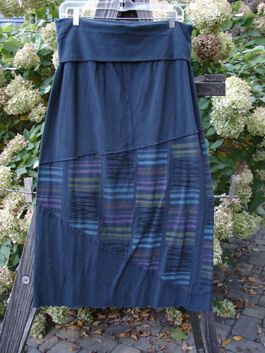 A Barclay Cotton Lycra Fold Over Column Skirt in Stripe Blue Mineral. Features a fold over waist panel, zig zag stitchery, and stripe triangular accents. Size 1.