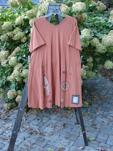 Image alt text: "1998 4 Elements Tress Dress Starburst Arausio Size 2: A dress on a rack with a sweet A-line shape, elongating skirt insets, and a gently scooped neckline."