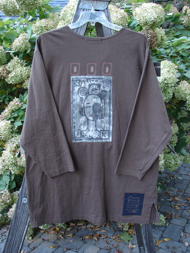 1996 Everyday Jacket Inner Woman Molasses Size 2: Long-sleeved shirt on a swinger with a picture of a woman's face.