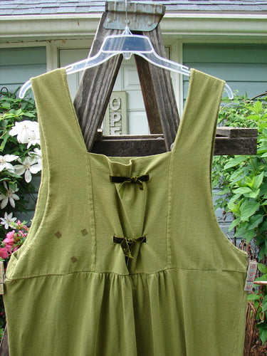 Vintage 1993 Tie Jumper featuring Mythical Goddess theme in Olive, Size 2. Squared bib with velvet ribbon ties, empire waist, deeper arm openings, and pegged hem. From Bluefishfinder.com's curated collection of unique, expressive pieces.