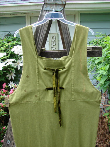A vintage 1993 Tie Jumper in Olive, Size 2, from BlueFishFinder.com. Features include a squared bib with velvet ribbon ties, empire waist seam, and mythical goddess theme paint. Bust 15, waist 48, hips 50, length 52.