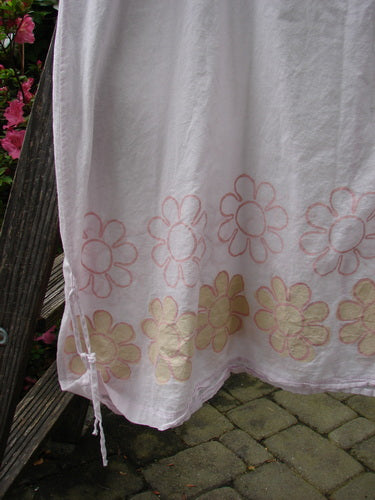 Barclay Batiste Round Neck Tie Up Shift Daisy Power Pink Cloud Size 2 displayed; white towel with pink flowers highlighting the fabric pattern.