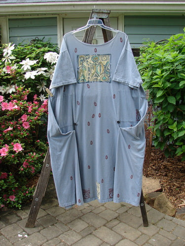 A rare 1991 Shape Dress from BlueFishFinder in Primitive Blue Clover pattern. Features sectional panels, drop shoulders, wide neckline, and unique square panels. Made of mid-weight cotton. Measurements: Bust 58, Waist 64, Hips 72, Length 58 inches.