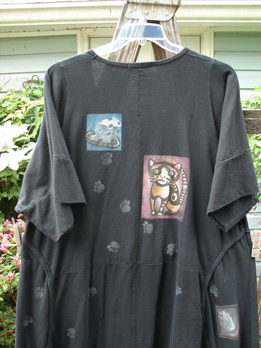 Barclay Double Pocket Bounce Tunic Dress Cat & Mouse Black Size 2 features oversized front pockets, upward scooped hemline, and unique cat and mouse themed illustrations.