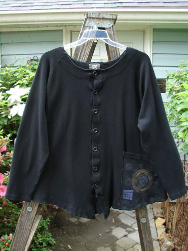Vintage 2000 Thermal Moonlight Cardigan Jacket in Black, Size 2. Swingy silhouette with oversized front pocket, rounded neckline, and rear pleats for a unique look. Perfect for expressing individuality.