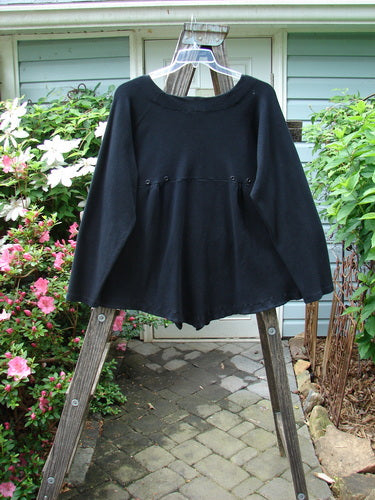 Vintage 2000 Moonlight Cardigan Jacket in Black, Size 2. Swingy silhouette with oversized front pocket, rounded hemline, and rear pleats for a unique back swing. Perfect for expressing individuality.
