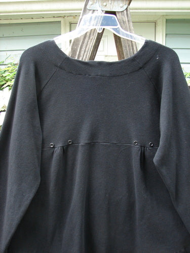 Vintage 2000 Moonlight Cardigan Jacket in Black, Size 2, from BlueFishFinder.com. Swingy silhouette with oversized front pocket, rounded hemline, and rear pleats for a unique look. Perfect for creative self-expression.