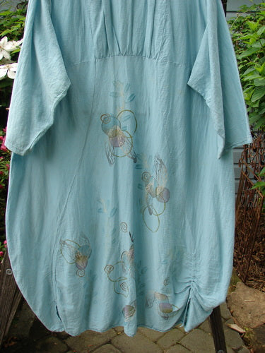 Barclay Hemp Cotton Silk Voile Belle Dress Wing Water Size 2 featuring blue floral design, dramatic rear reverse yoke backline, and unique vertical ruching for a distinctive, flowing silhouette.
