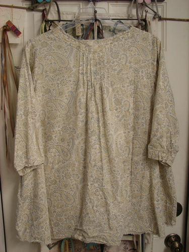 Magnolia Pearl NWT European Cotton Bondi Blouse Fleuri OSFA, featuring a creamy beige paisley print, raw-edged V neckline, billowy three-quarter sleeves, and pintuck plackets, showcasing elegant, relaxed sophistication.