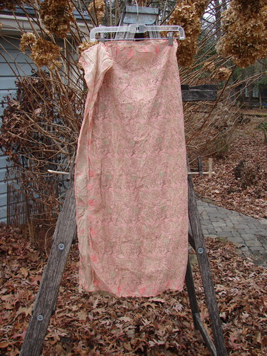 Magnolia Pearl NWT European Cotton MP Block Print Scarf Rosette displayed outdoors, showcasing its sheer, flowing fabric with a continuous floral and leaf pattern, clipped to a wooden ladder amidst winter foliage.