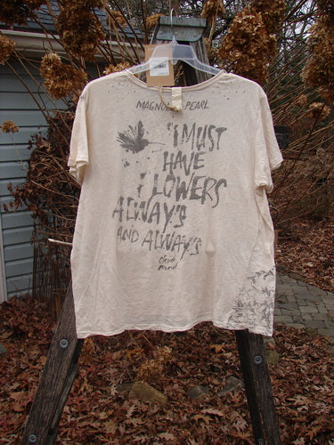 Magnolia Pearl NWT Cotton Jersey Boyfriend Tee Always & Always Moonlight OSFA hangs on a wooden A-frame, showcasing its drapey silhouette, bird silhouette print, and Monet quote.