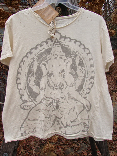 Magnolia Pearl NWT Cotton Jersey Boyfriend Tee Ganesh Moonlight OSFA showcased on a hanger, featuring a stylized Ganesha print, rolled edges, and upper shoulder distressing, epitomizing Bluefishfinder.com's dedication to unique, expressive fashion.