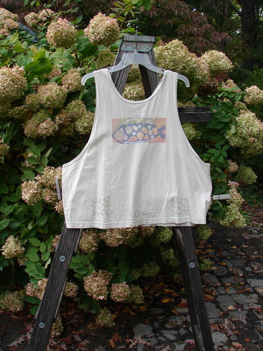 Image alt text: "1999 Tank Top Goldfish Dust Size 2: A white tank top with a colorful goldfish theme paint, featuring a wide slightly longer boxy shape and a scooped neckline."