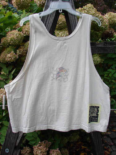 1999 Tank Top Goldfish Dust Size 2: A white tank top on a hanger. Features a colorful goldfish theme paint and the signature Blue Fish patch. Perfect for hot summer days.