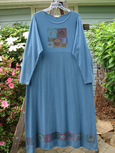 Barclay Hemp Cotton Curved A Line Dress Elements Tealen Blue Size 2, featuring a vintage theme paint design, hanging on a clothesline, highlighting its extra-long length and wide A-line shape.