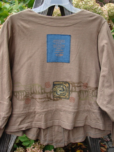 1997 Treehouse Jacket Primitive Climb Lumber Size 1: Brown shirt with blue patch, double paneled V neck, drawcord flounce, and signature Blue Fish patch.