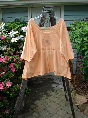 Barclay Be There Top with Pinwheel Power theme in Pastel Tangerine, Size 2, features a squared double paneled neckline, empire waist seam, wide pleats, and a flowing skirt flair. Vintage Blue Fish Clothing at BlueFishFinder.com.
