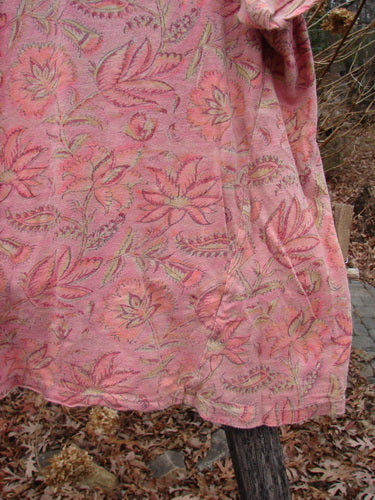 Magnolia Pearl NWT Cotton Jersey Boyfriend Tee Remi Block Print Sunset Flower OSFA displayed outdoors, draped on a wooden post, highlighting its lightweight fabric and floral pattern, reflecting Bluefishfinder's vintage-inspired style.