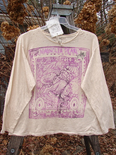 Magnolia Pearl NWT Cotton Jersey Boyfriend Tee Spiritual Walk Carousel OSFA features a stylized elephant motif with decorative borders, displayed outdoors on a hanger, embodying a relaxed, artistic style.