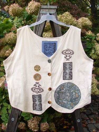 A vintage white vest from the 1993 Summer Collection in Tea Dye. Features include tuxedo style front tails, a draw corded back, and a festive medallion theme. Size 2.