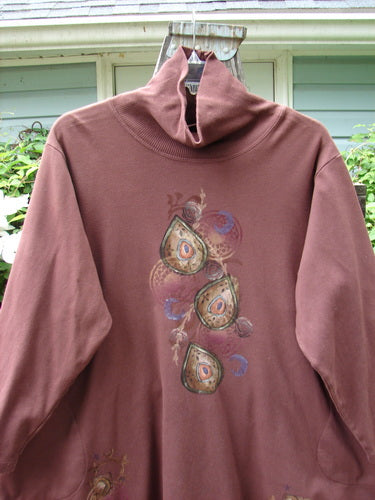 Barclay Interlock Turtleneck Pullover Tunic Top Celtic Paisley Sepia Size 2 displayed with ribbed turtleneck, side pockets, and banded hem, showcasing a cozy, double-layered fleece fabric.