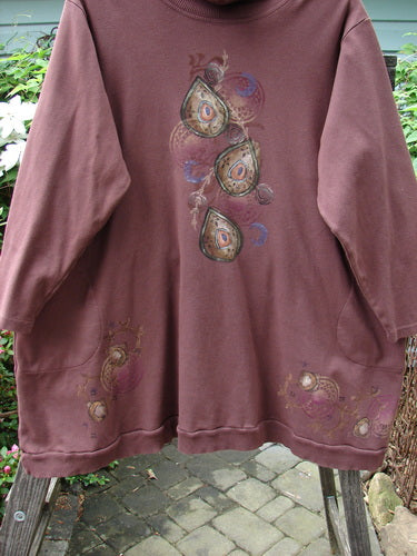 Barclay Interlock Turtleneck Pullover Tunic Top Celtic Paisley Sepia Size 2, featuring ribbed turtleneck, side entry front pockets, banded hem, and draw cord back, made from double-layered cozy fleece fabric.