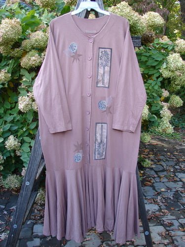1994 Column Dress Magical Nature Cliff Size 2: A long pink dress on a wooden ladder. Full button duster shape with an elongating paint design. Flouncy bottom kick and V-shaped neckline. Longer sleeves and U-shaped upper shoulder seam.