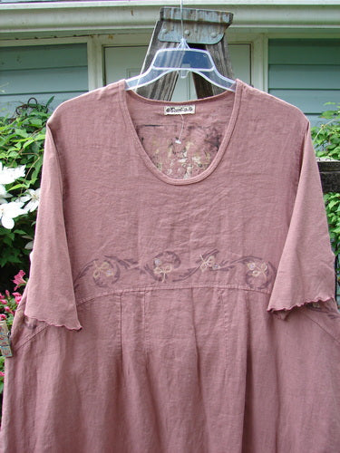 Barclay Linen Cotton Sleeve Banded Hem Pleat Dress Bird Gal Dusty Mauve Size 2 displayed on a white hanger, highlighting its rounded neckline, empire waist, and vertical pleats, ideal for summer wear.