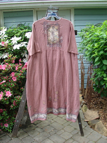 Barclay Linen Cotton Sleeve Banded Hem Pleat Dress Bird Gal Dusty Mauve Size 2 displayed on a hanger, showcasing its rounded neckline, empire waist seams, and three-quarter length sleeves.