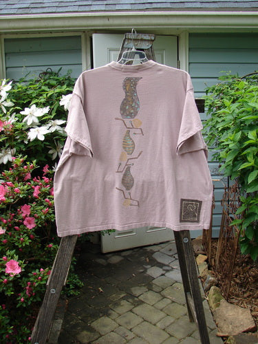 Vintage 1995 Short Sleeved Tee featuring a detailed vase design on Patio Rose background. Altered to size 2, with ribbed neckline and drop shoulders. Organic cotton blend. Bust 62, Waist 62, Hips 62, Length 30.