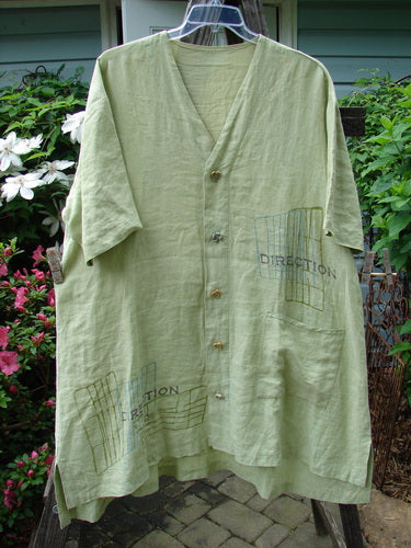 2000 Cross Dye Linen Downtown Jacket in Celery, Size 2, from BlueFishFinder.com. A green shirt with a logo on it, ceramic glazed buttons, A-line shape, V-shaped neckline, and oversized pocket. Bust 52, Waist 56, Hips 60.