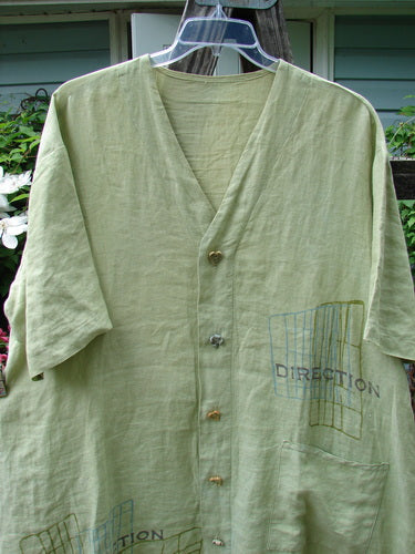 2000 Cross Dye Linen Downtown Jacket Directional Celery Size 2 from BlueFishFinder.com: A green linen jacket with ceramic buttons, A-line shape, and oversized pocket. V-neck, shirt tail hemline, and vented sides.