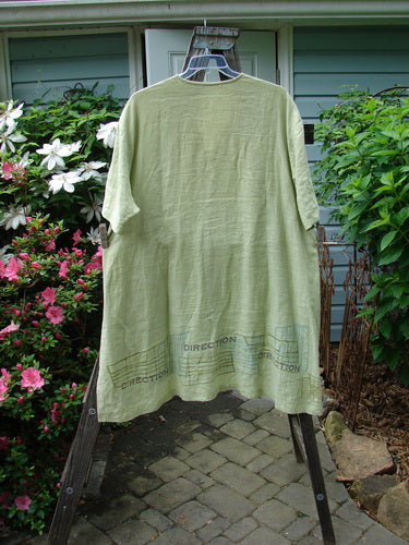 2000 Cross Dye Linen Downtown Jacket in Celery, Size 2, from BlueFishFinder.com. A unique A-line jacket with ceramic buttons, V-neckline, and directional theme paint. Generously sized with a shirt tail hemline and vented sides.