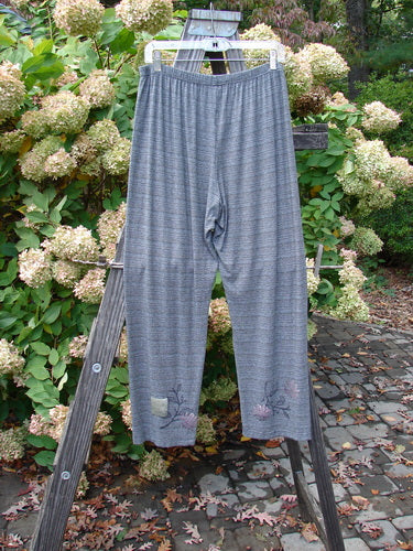 2000 Rayon Lycra Stripe Duo Cliffshadow Stripe Size 2: A pair of pants on a wooden ladder, part of the Fall Collection.