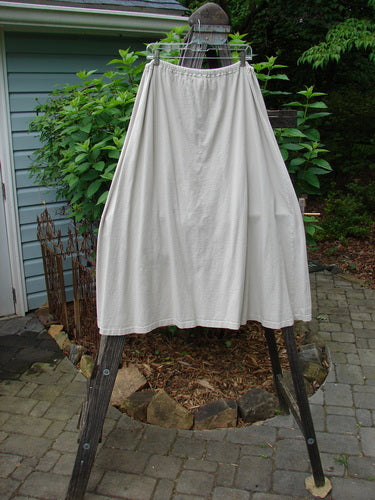 1994 Everywhere Skirt Magical Fish Mist Size 1: A white sheet on a clothes line, with a wood post and metal fence in the background. Vintage Blue Fish Clothing from BlueFishFinder.com.