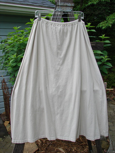 Vintage 1994 Everywhere Skirt in Magical Fish Mist Size 1, showcasing a white skirt on a clothesline outdoors. Features a full A-lined silhouette, lower front pocket with Diamond Fern accents, and a drawcord waistline.
