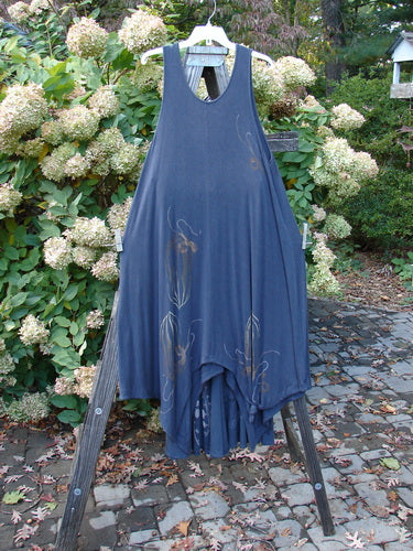 1998 Rayon Lycra Botanicals Tendril Mayflower Duo Onyx Size 1: A blue dress with a flower design on a wooden stand.
