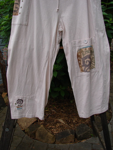 1996 Seed Planting Pant Abstract Garden Birch Bark Size 1: Relaxed fit, three front pockets, one side pocket, drawstring waist, organic cotton, garden-themed paint, and blue paper buttons.