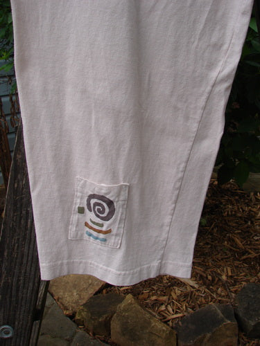 1996 Seed Planting Pant Abstract Garden Birch Bark Size 1, featuring three front pockets with blue buttons, inseam side pocket, drawstring waistline, and relaxed drape with garden-themed paint.